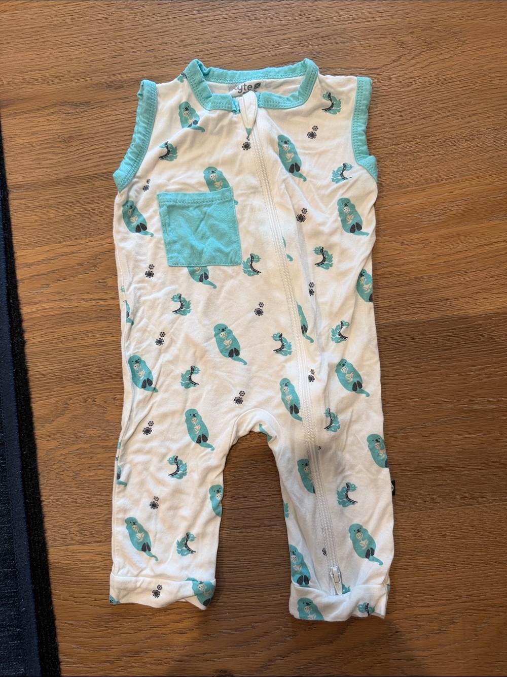 Kyte BABY White Romper with Teal Trim and Seal Motif